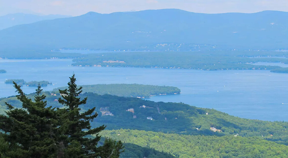 Sunny summer view from high elevation, overlooking the area the Gunstock Resort is located in