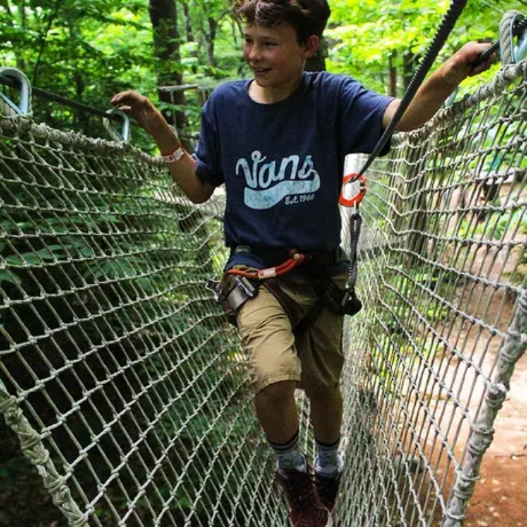 Smiling Boy on course in Aerial Treetop Adventures