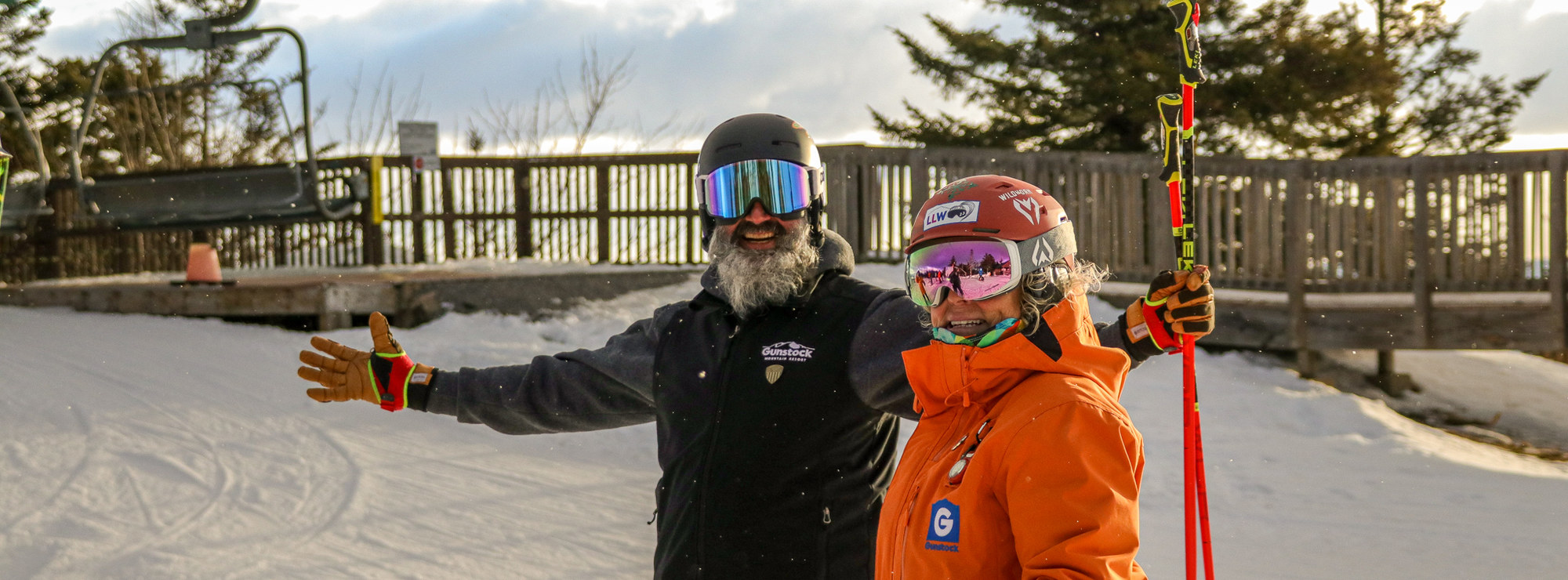 Man and woman pose in front of panorama lift