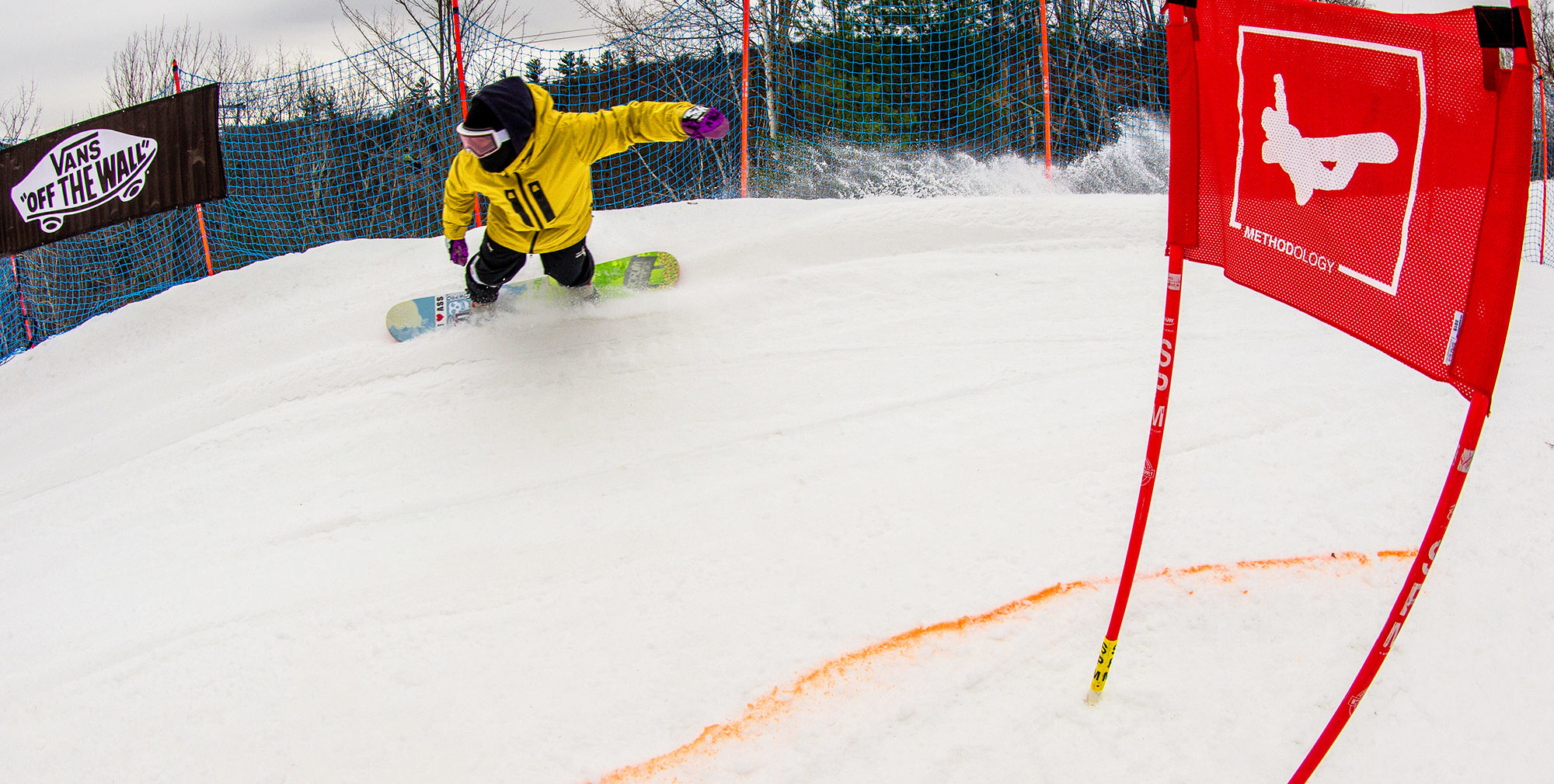 Snowboarder in race course