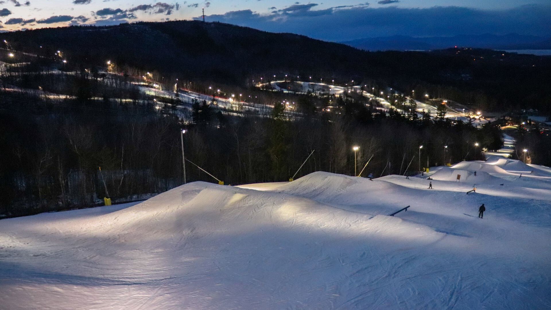 Blundersmoke Terrain Park at night with lights on.