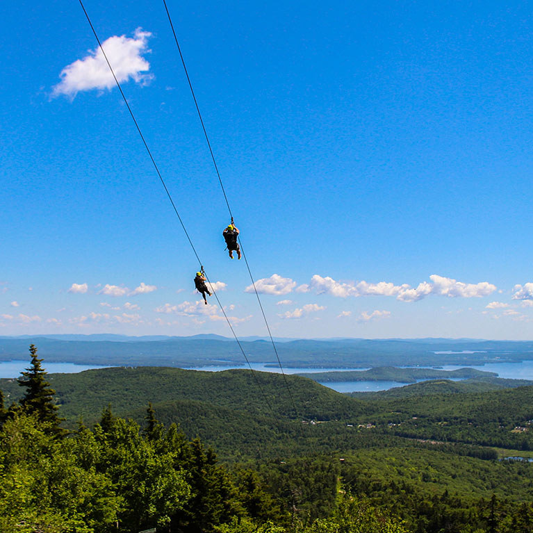 Ziplining with a view of the lake.