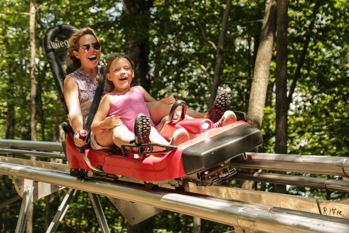Mother and daughter enjoying their ride on the Mountain Coaster.